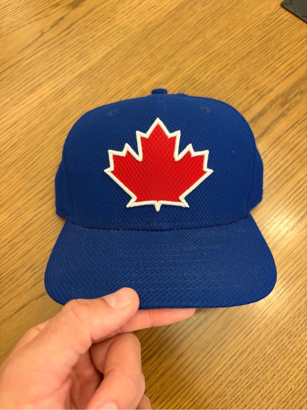 New Era Royal Blue Hat with Red Maple Leaf Patch